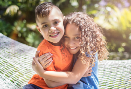 Two children hugging