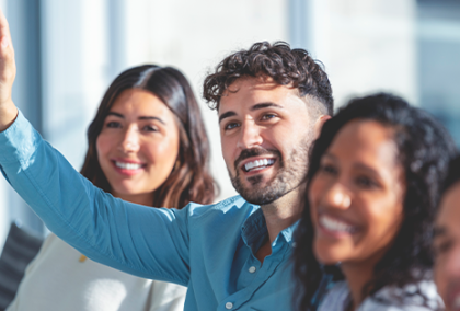 Man with a hand up, asking a question