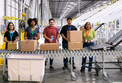 warehouse team packing looking forward and smiling