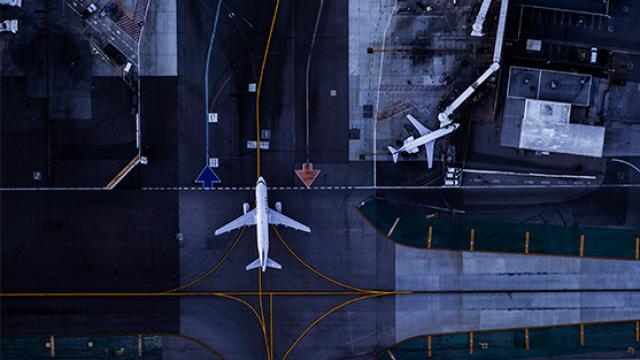 Aerial view of airport and planes.