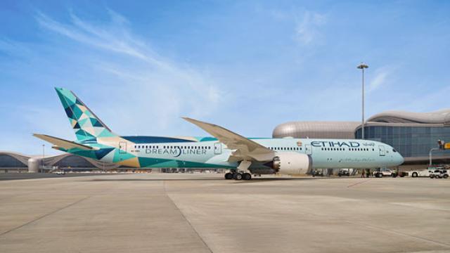 Etihad Dreamliner at airport gate