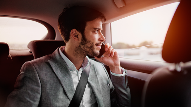 Man on mobile phone whilst in a car