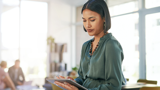Flexible travel policy, lady on her tablet reading