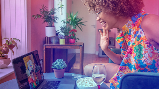 Woman smiling at event online