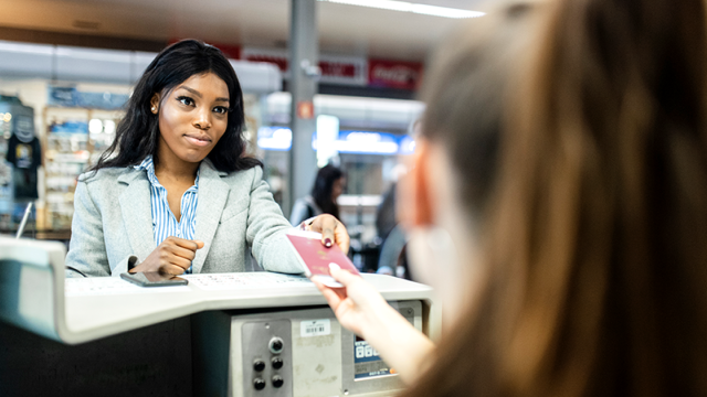 Woman handing over passport