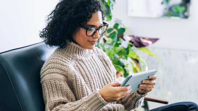 Woman reading tablet