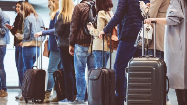 Group of people waiting at boarding gate
