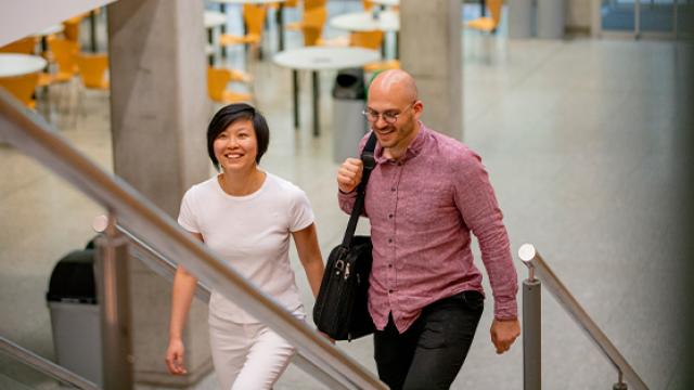 people walking upstairs in an office