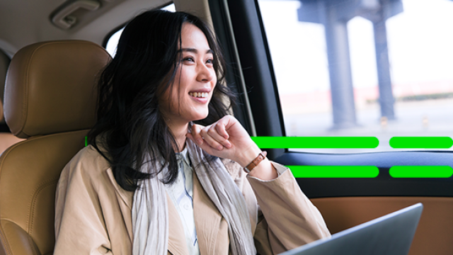 Asian looking out of car window