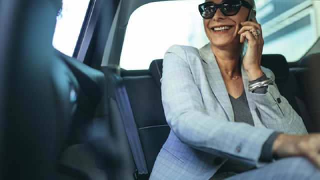 Women smiling in car.png