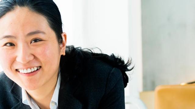 Happy businesswoman in hotel room