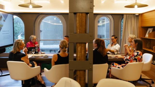 people sitting at table in discussion