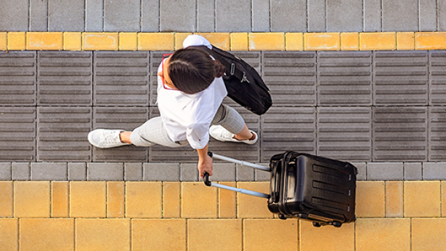 women walking with a suitcase