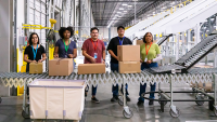 warehouse team packing looking forward and smiling