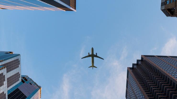 Plane over city