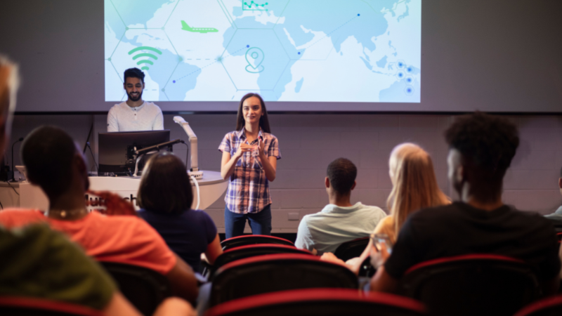 Person speaking in front of crowd