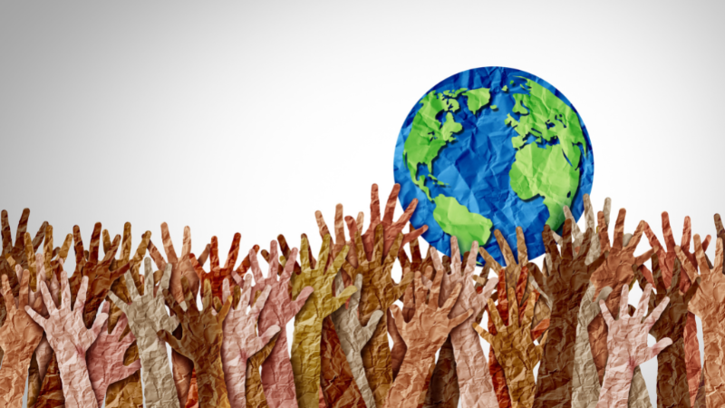 People holding world artwork