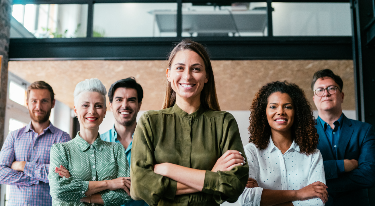 6 people standing arms crossed