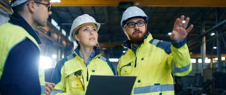 3 construction workers discussing on site