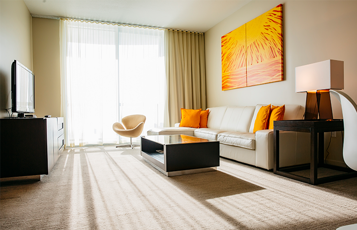Hotel Room with orange accents.
