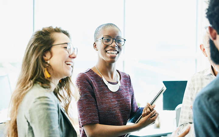 Two ladies smiling and laughing