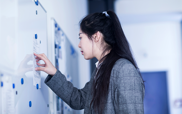 Woman hanging flyers