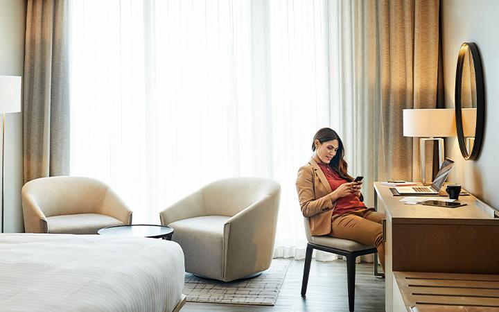 women sitting in accor hotel room on phone