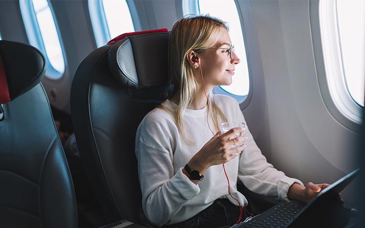 women sitting on plane