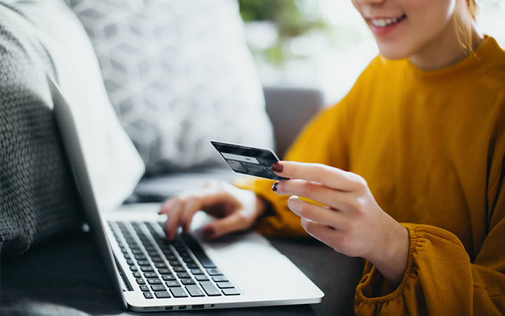 Lady inputting credit card details via online