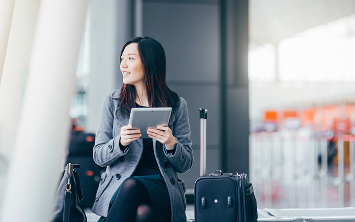 lady at the airport reading a book