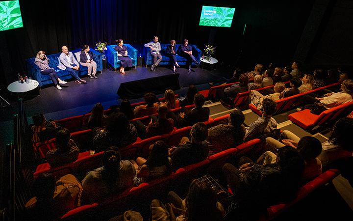People in theater on stage