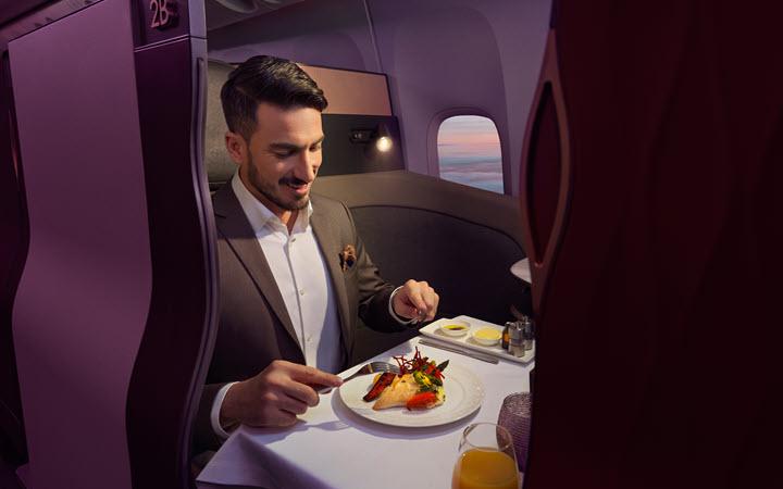 man eating food on a flight
