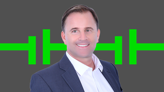 Photograph of smiling man in suit over green barbell-like graphic on gray background