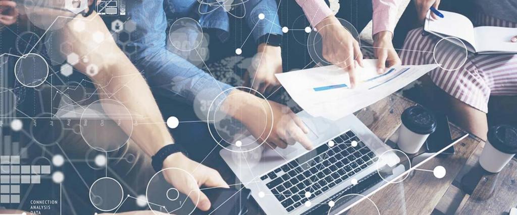 Evaluating the results holding paper and laptop