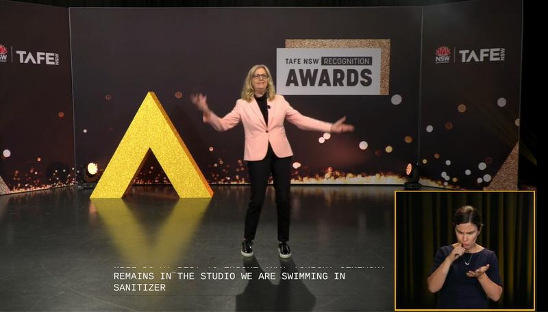 Speaker presenting on stage with translator