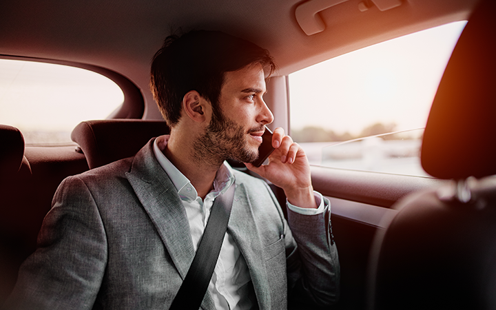 Man on mobile phone whilst in a car