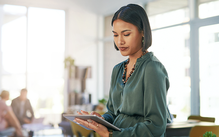 Flexible travel policy, lady on her tablet reading