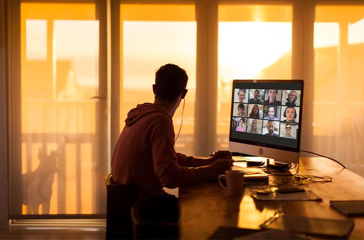 Man on zoom call looking out window.