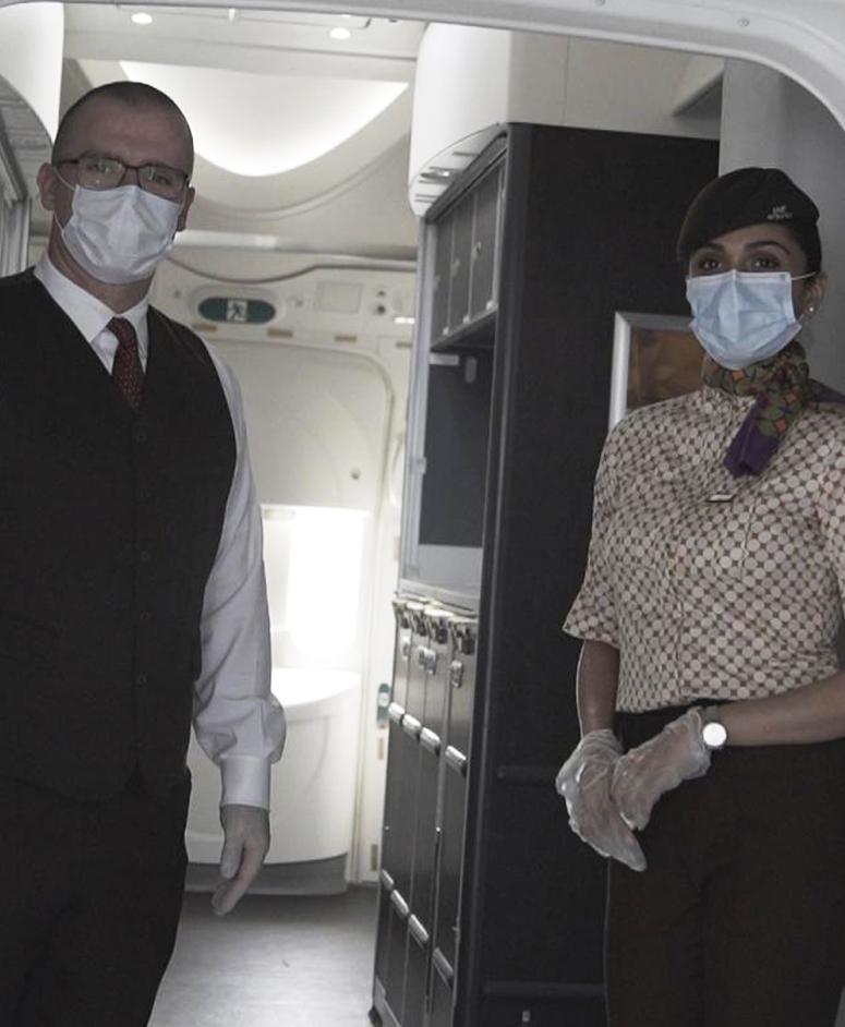 Etihad hostess' on plane.