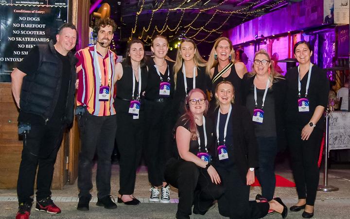 Group of people smiling for photo