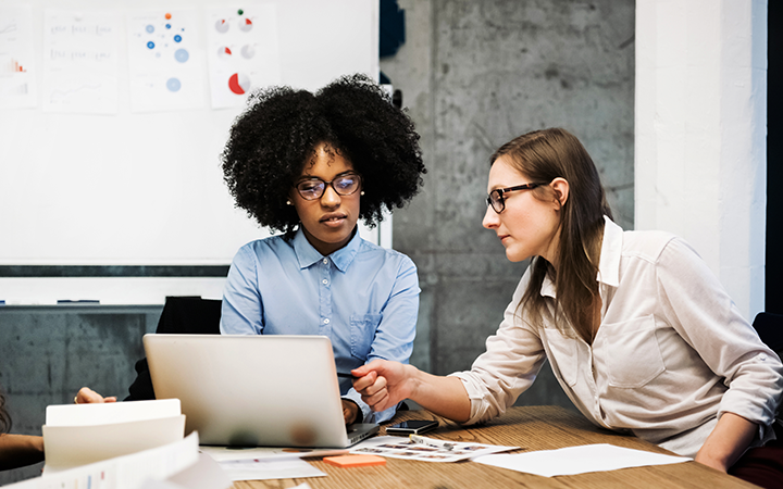 Two Ladies At Laptop
