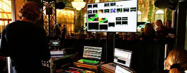 M&E Man looking at images on screen