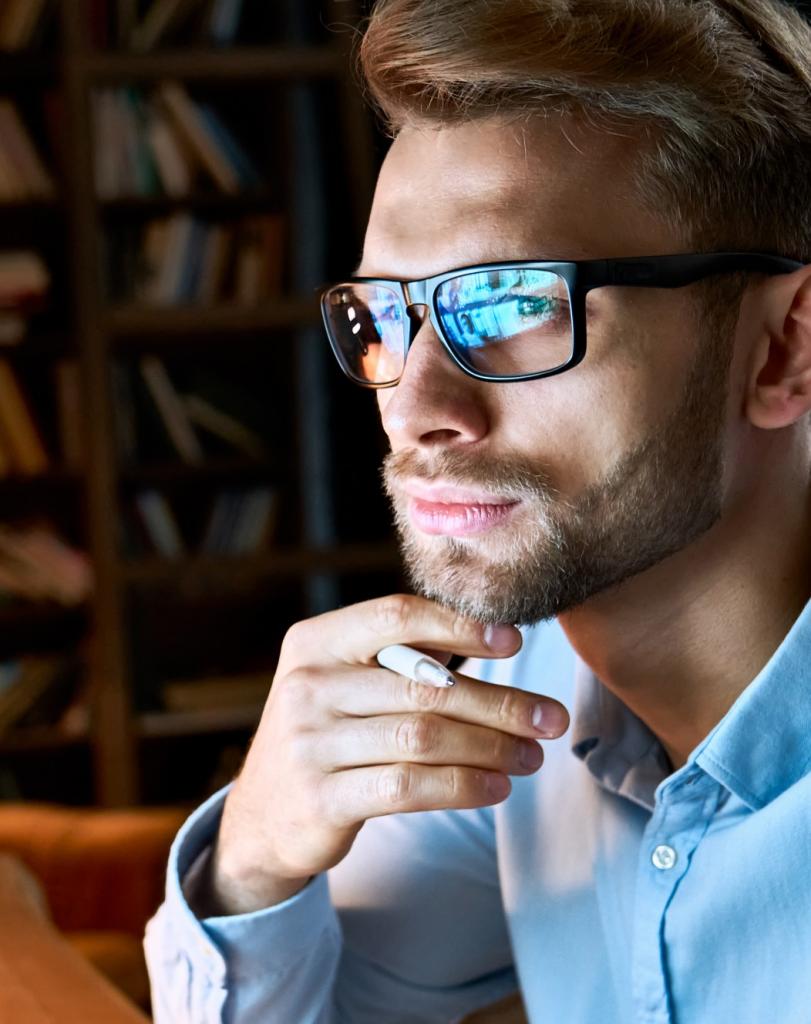 Man staring at stats on a screen