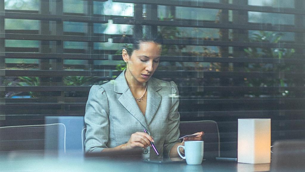 Businesswoman using card for online booking