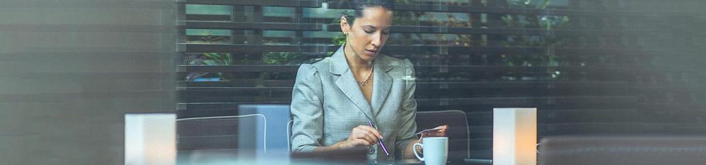 Businesswoman using card for online booking