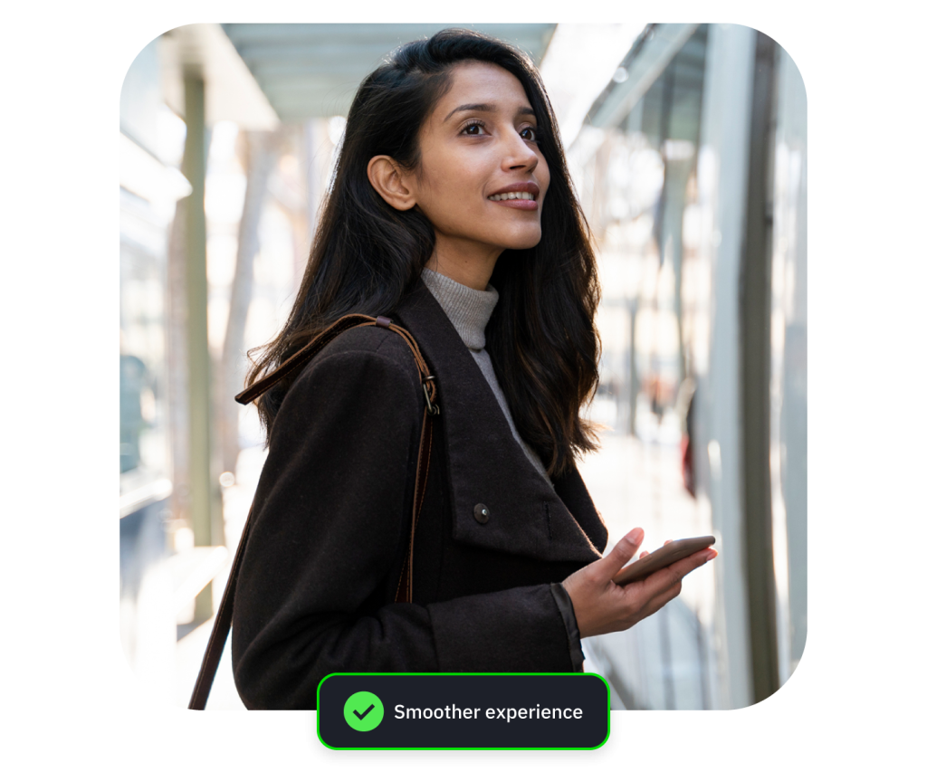 Young woman in coat gestures in glass corridor, with green “Smoother experience” badge overlay