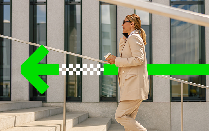 woman walking holding coffee