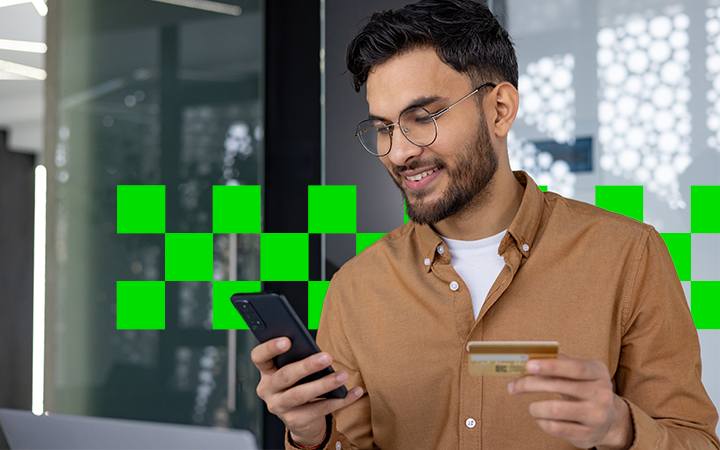 Business traveller managing travel expenses on his phone