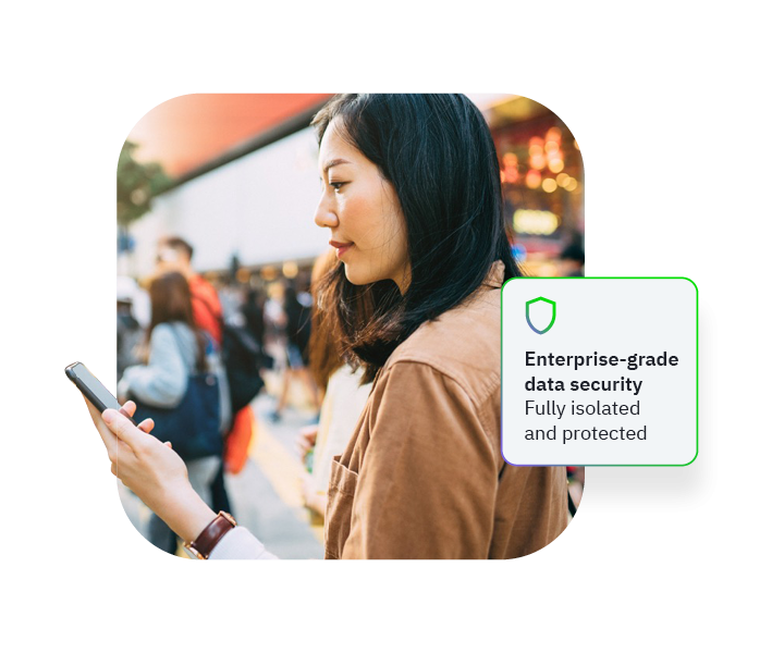 Person holding smartphone on busy street, face blurred, overlay text Enterprise-grade data security