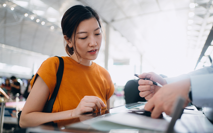 Women at the checkin counter at the airport